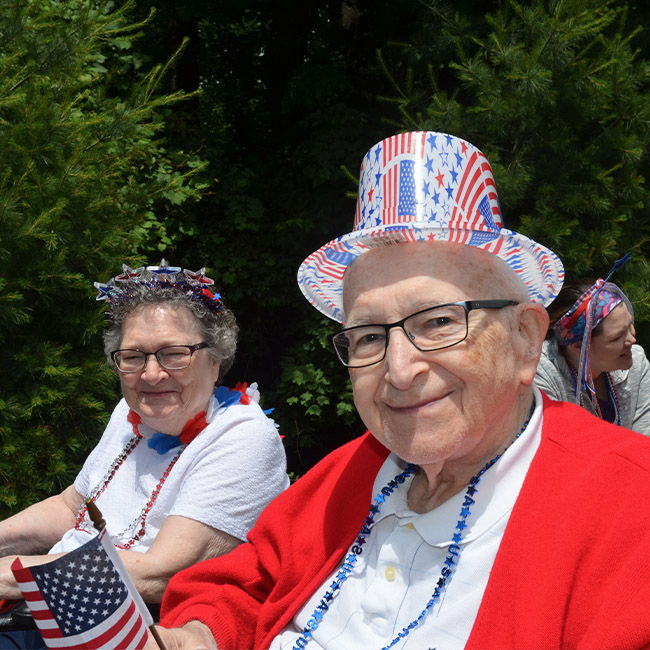 elderly man and lady watching a parade in Kalamazoo