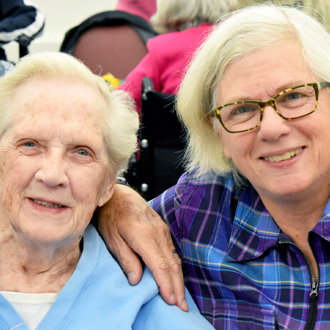 woman visiting parent at a senior center